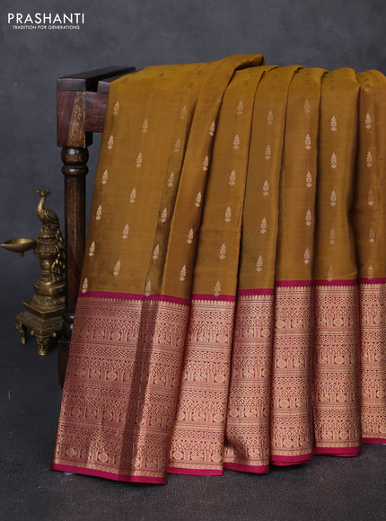 Kanchipuram silk saree dark mustard and magenta pink with allover zari woven buttas and long zari woven border