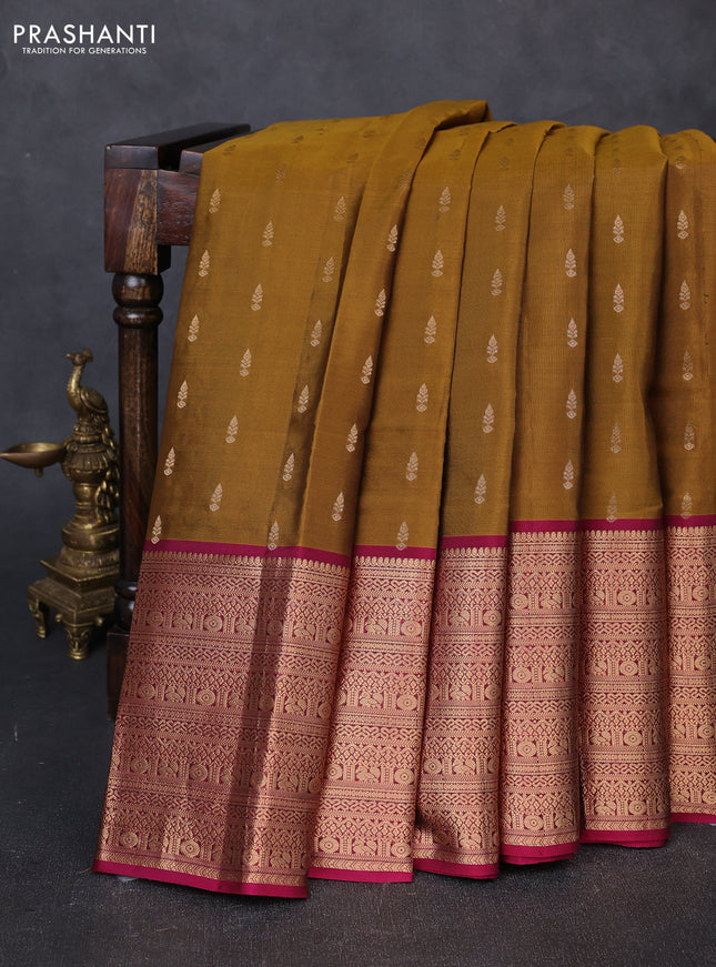 Kanchipuram silk saree dark mustard and magenta pink with allover zari woven buttas and long zari woven border