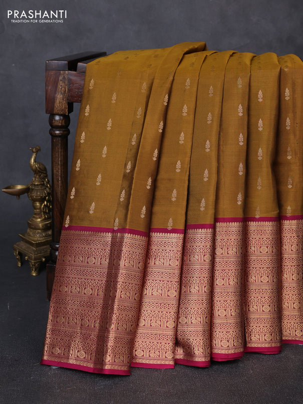 Kanchipuram silk saree dark mustard and magenta pink with allover zari woven buttas and long zari woven border