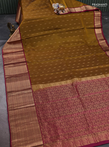 Kanchipuram silk saree dark mustard and magenta pink with allover zari woven buttas and long zari woven border