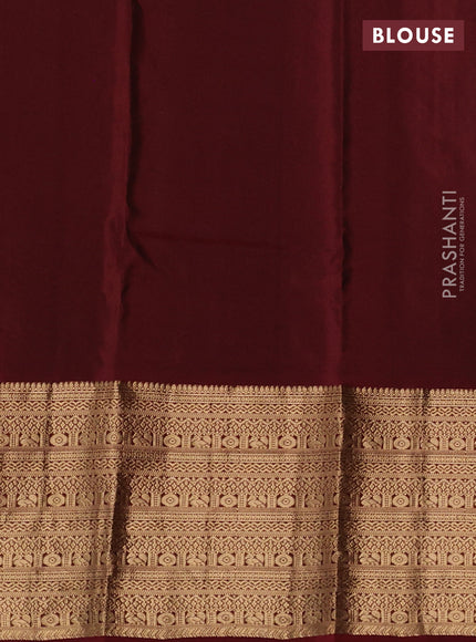 Kanchipuram silk saree green and maroon with allover zari woven buttas and long zari woven border