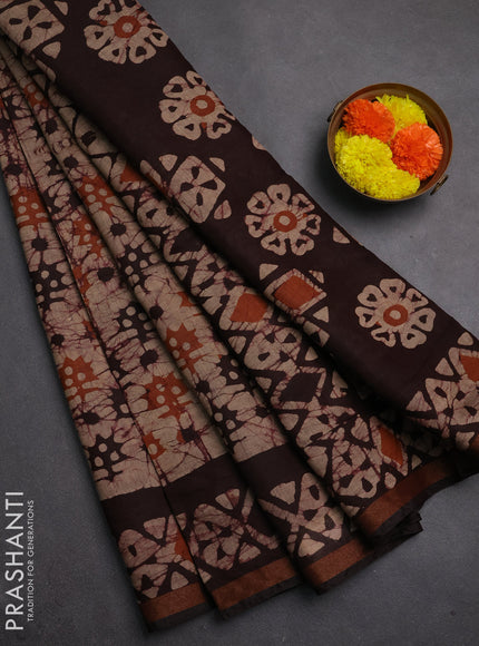 Muslin cotton saree coffee brown with allover batik prints and zari woven border