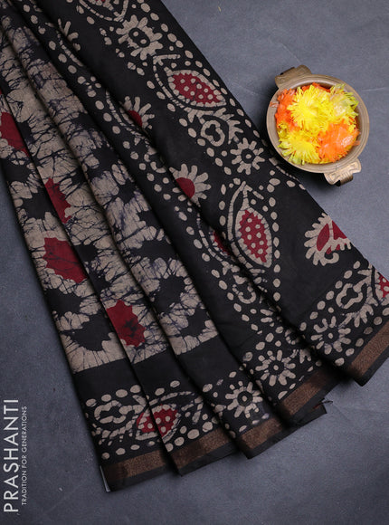 Muslin cotton saree black with allover batik prints and zari woven border