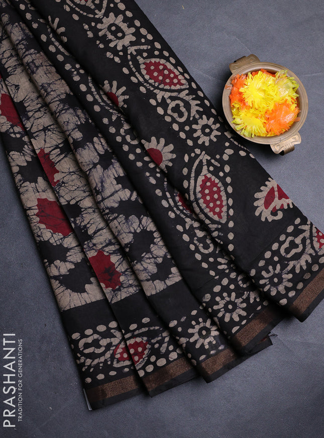 Muslin cotton saree black with allover batik prints and zari woven border