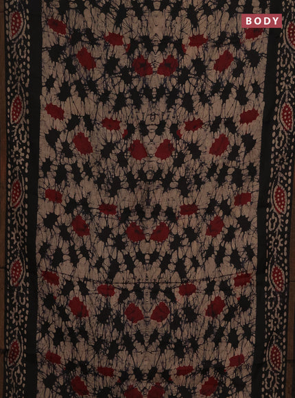 Muslin cotton saree black with allover batik prints and zari woven border