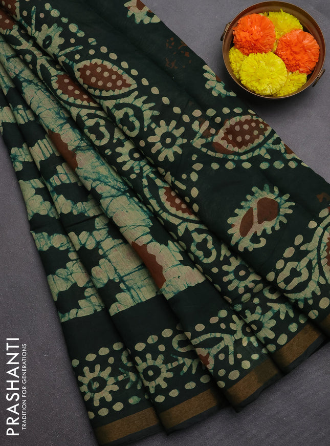 Muslin cotton saree bottle green with allover batik prints and zari woven border