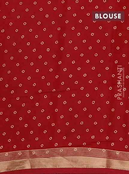 Muslin cotton saree maroon with allover ajrakh prints and zari woven border