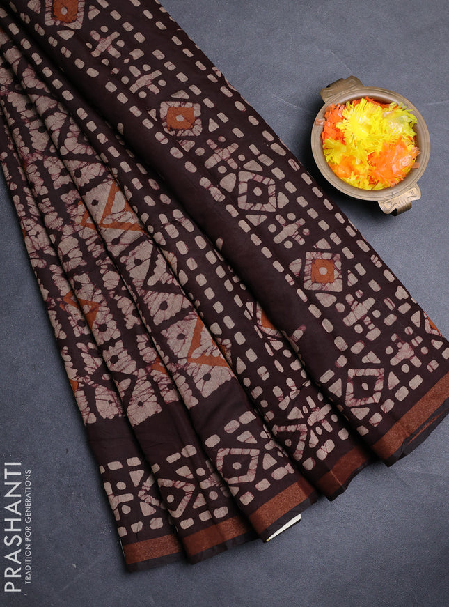 Muslin cotton saree wine shade with allover batik prints and zari woven border