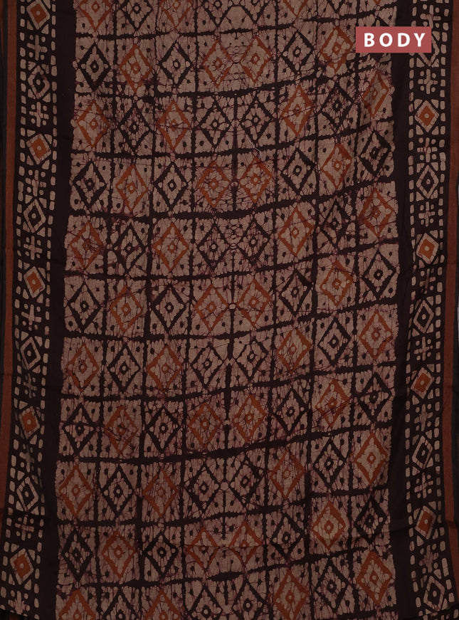Muslin cotton saree wine shade with allover batik prints and zari woven border
