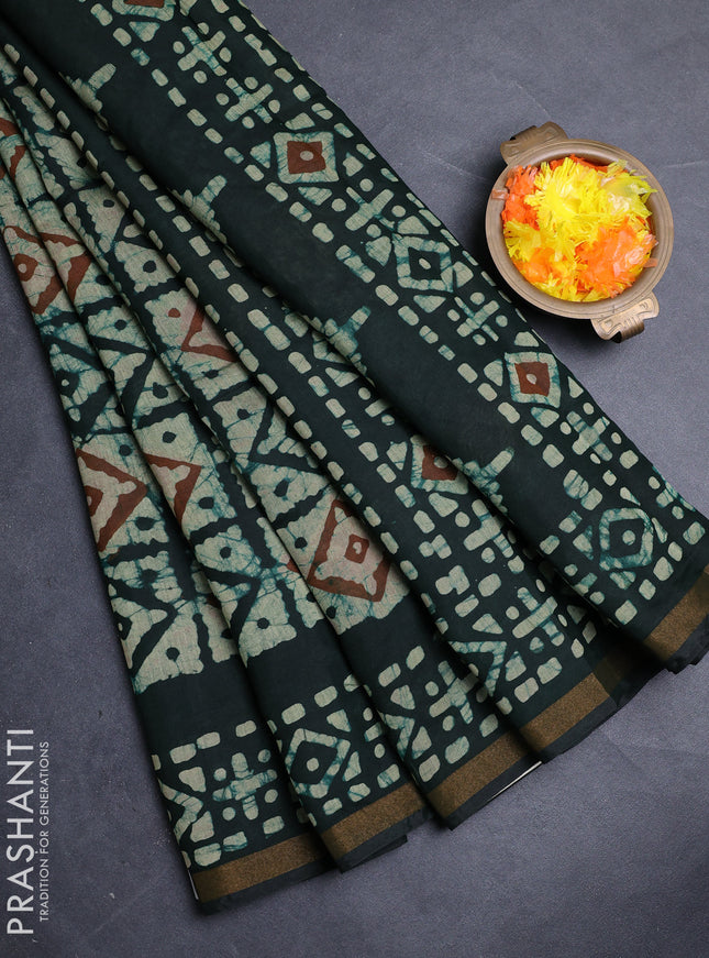 Muslin cotton saree bottle green with allover batik prints and zari woven border