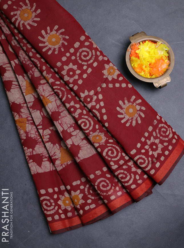 Muslin cotton saree maroon with allover batik prints and zari woven border