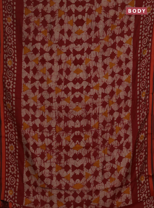 Muslin cotton saree maroon with allover batik prints and zari woven border