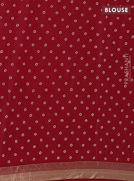 Muslin cotton saree maroon with allover ajrakh prints and zari woven border