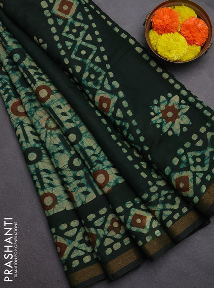 Muslin cotton saree bottle green with allover batik prints and zari woven border