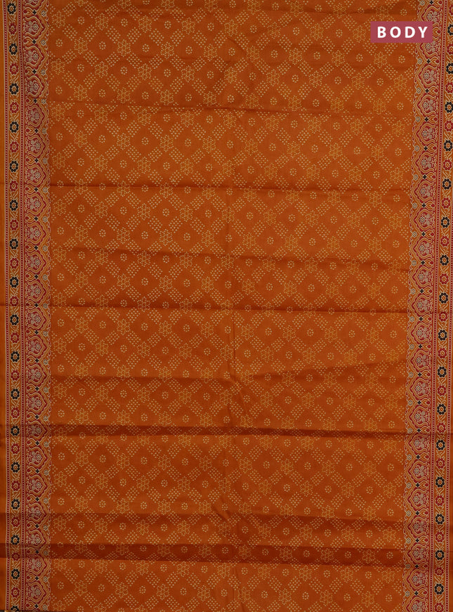Muslin cotton saree dark mustard with allover bandhani prints and printed border