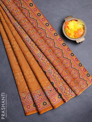 Muslin cotton saree dark mustard with allover bandhani prints and printed border