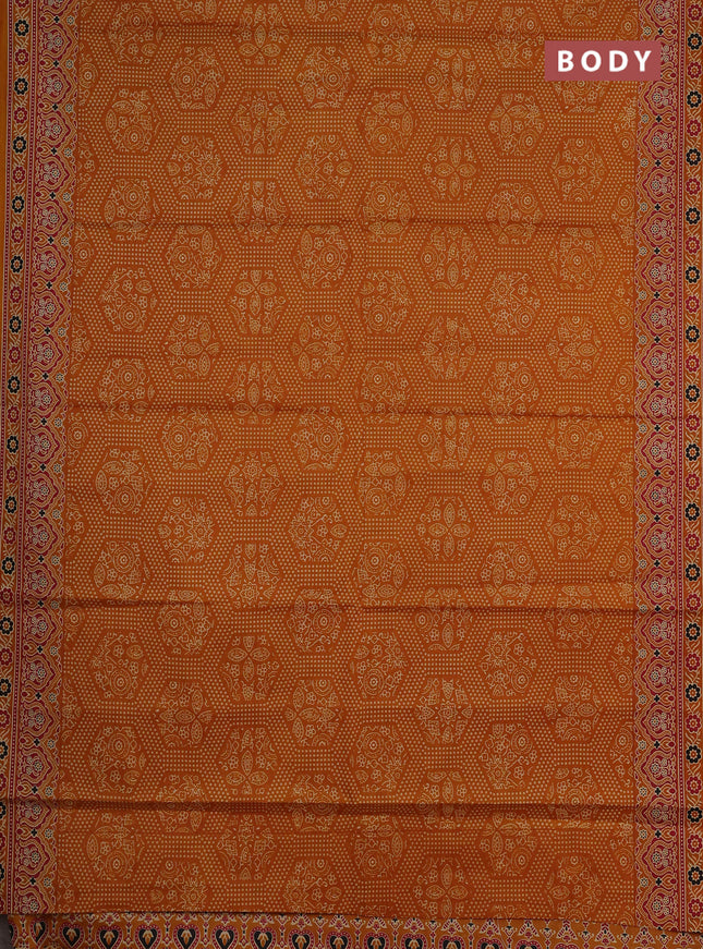 Muslin cotton saree dark mustard with allover bandhani prints and printed border