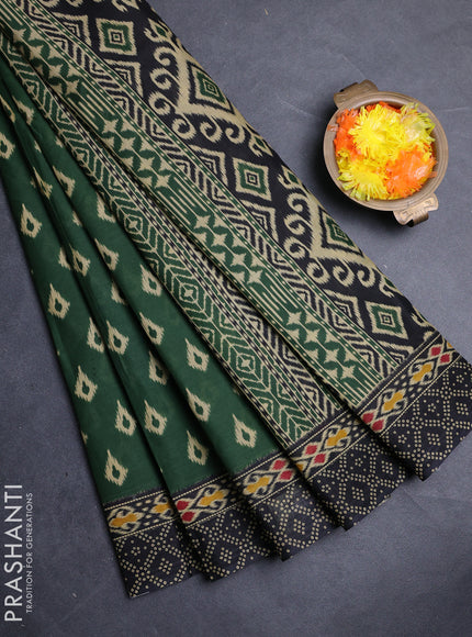 Muslin cotton saree green and black with allover ikat prints and printed border