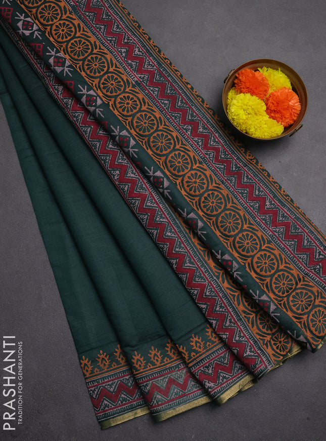 Muslin cotton saree peacock green with allover black prints and printed border