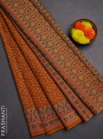 Muslin cotton saree dark mustard with allover bandhani prints and printed border