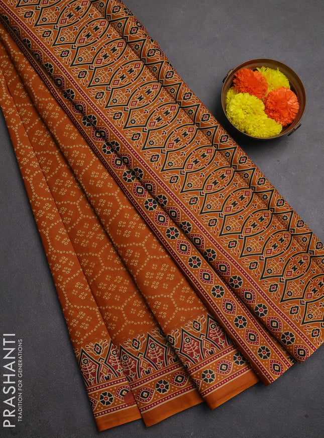 Muslin cotton saree dark mustard with allover bandhani prints and printed border