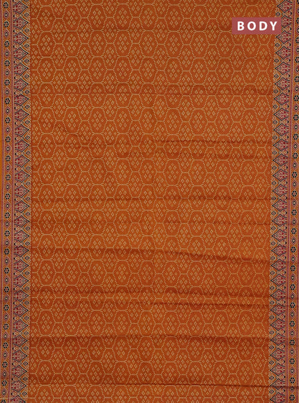 Muslin cotton saree dark mustard with allover bandhani prints and printed border