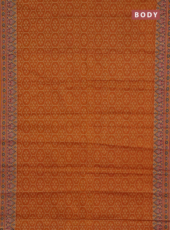Muslin cotton saree dark mustard with allover bandhani prints and printed border