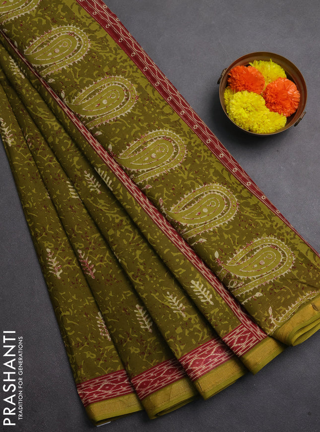 Muslin cotton saree mehendi green with allover dabu prints and printed border