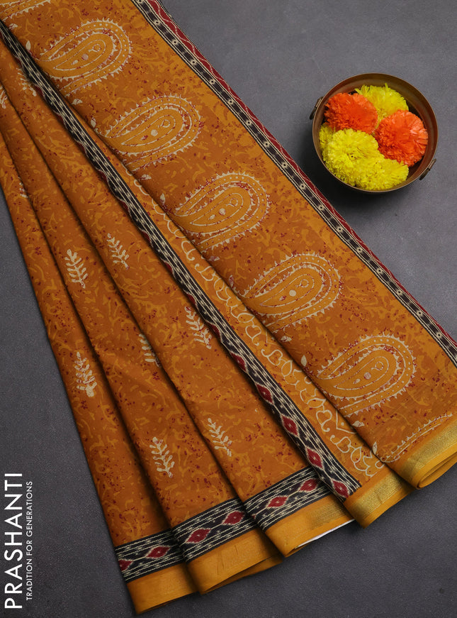 Muslin cotton saree mustard yellow with allover dabu prints and printed border
