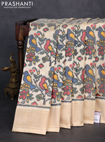 Pochampally silk saree black and cream with allover ikat weaves and zari woven border