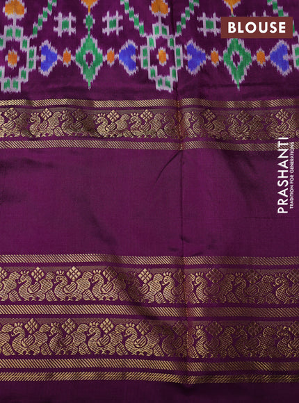 Pochampally silk saree green and purple with allover ikat woven buttas and temple design long zari woven border