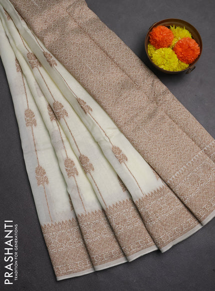 Banarasi semi raw silk saree cream with allover thread & zari weaves and woven border