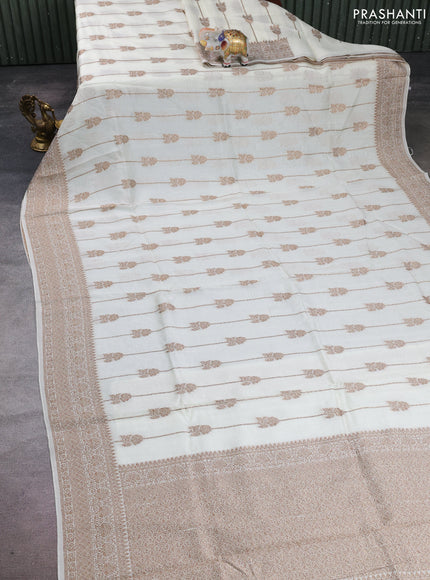 Banarasi semi raw silk saree cream with allover thread & zari weaves and woven border