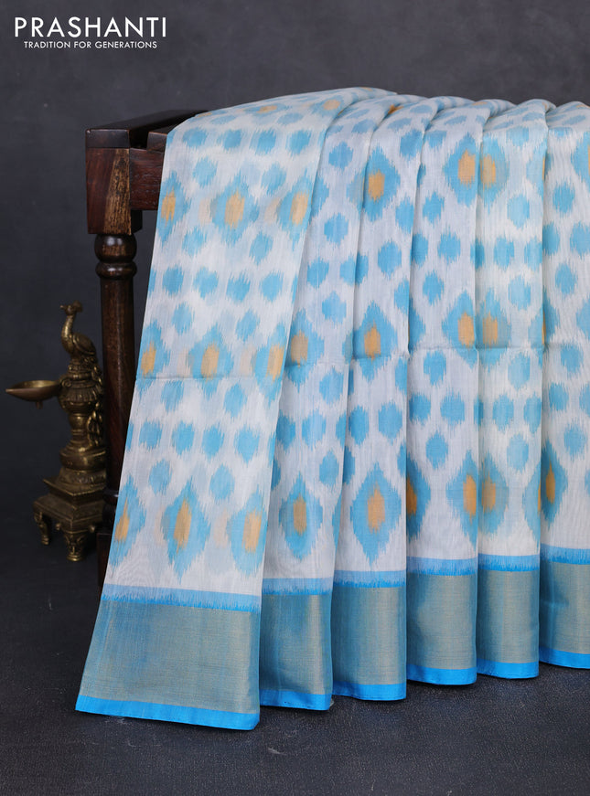 Ikat silk cotton saree off white and cs blue with allover ikat weaves and zari woven border