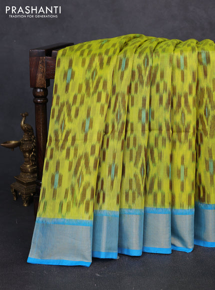 Ikat silk cotton saree fluorescent green and cs blue with allover ikat weaves and zari woven border