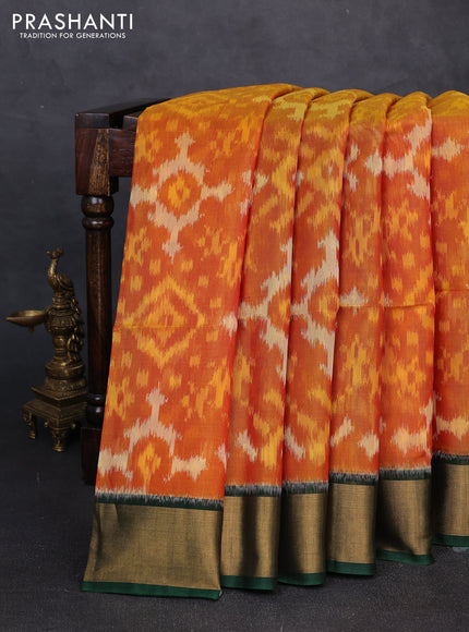Ikat silk cotton saree orange and bottle green with allover ikat weaves and zari woven border