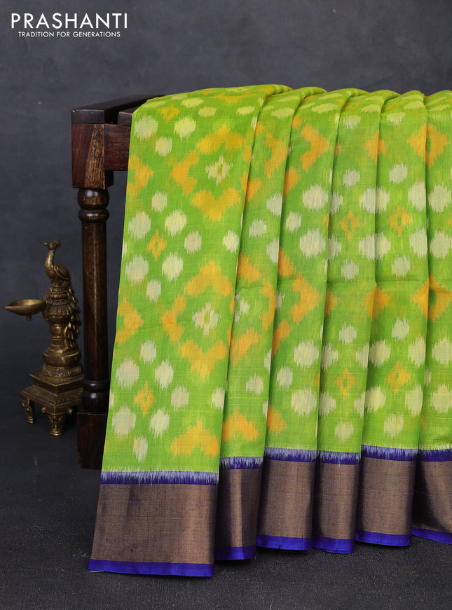 Ikat silk cotton saree light green and royal blue with allover ikat woven buttas and zari woven border