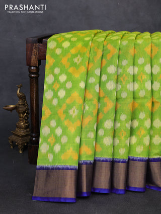 Ikat silk cotton saree light green and royal blue with allover ikat woven buttas and zari woven border