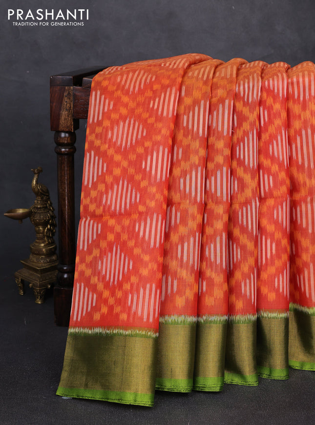 Ikat silk cotton saree orange red and light green with allover ikat weaves and zari woven border