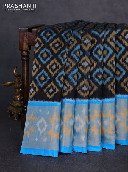 Ikat silk cotton saree black and cs blue with allover ikat weaves and long zari woven border