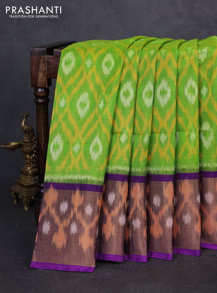 Ikat silk cotton saree light green and purple with allover ikat weaves and long zari woven border