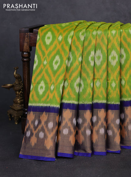 Ikat silk cotton saree green  and blue with allover ikat weaves and long zari woven border