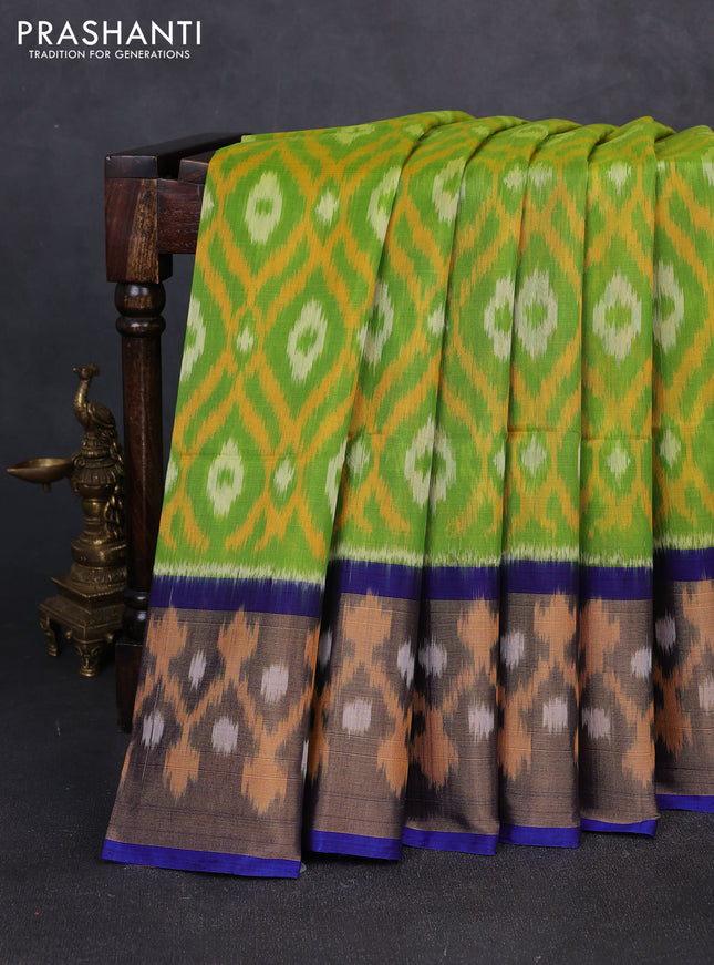Ikat silk cotton saree green  and blue with allover ikat weaves and long zari woven border
