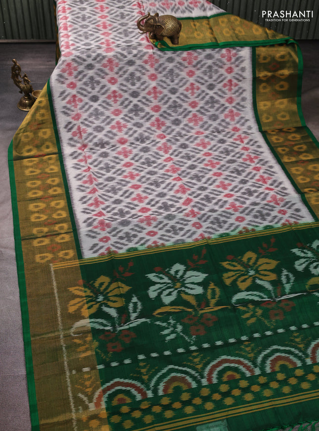 Ikat silk cotton saree off white and green with allover ikat weaves and long zari woven border