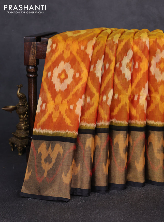 Ikat silk cotton saree orange and black with allover ikat weaves and long zari woven border