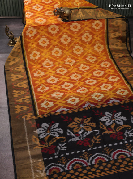 Ikat silk cotton saree orange and black with allover ikat weaves and long zari woven border