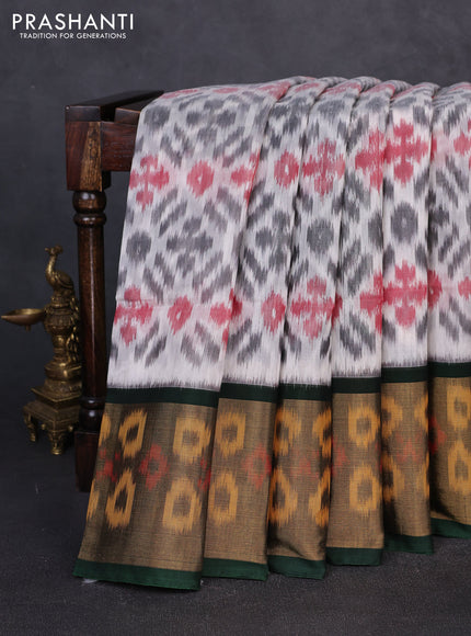 Ikat silk cotton saree off white and bottle green with allover ikat weaves and long zari woven border
