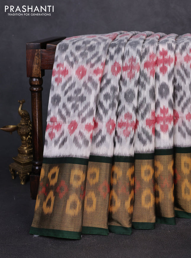 Ikat silk cotton saree off white and bottle green with allover ikat weaves and long zari woven border