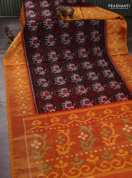 Ikat silk cotton saree black and orange with allover ikat weaves and long zari woven border