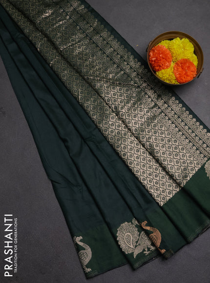 Semi chanderi saree bottle green with plain body and zari woven border